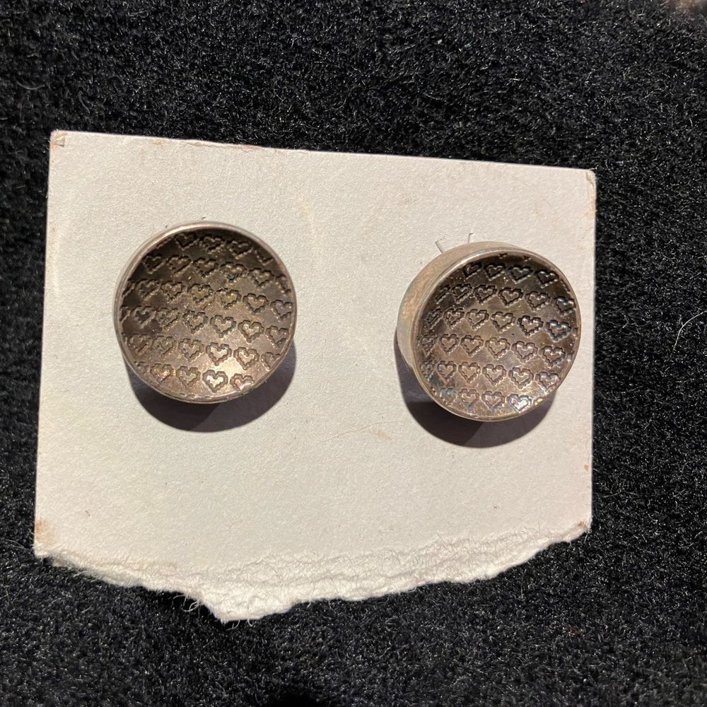 Never worn round silver earrings, approximately .75 inches tall - Picture 1 of 2